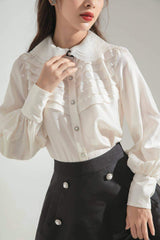 Silk A-line skirt with pearl button accents and structured silhouette for elevated daywear