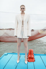 Structured longline blazer with sharp shoulders and a contoured waistline