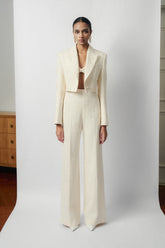 Textured wool-blend cropped jacket with peak lapels and structured shoulder tailoring