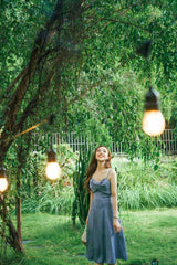 Silk slip midi dress with cowl neckline and adjustable straps for graceful summer styling