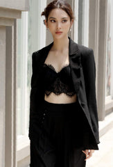 Tailored silk blazer with minimalist lapel and refined structure for elevated modern looks
