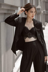 Tailored silk blazer with minimalist lapel and refined structure for elevated modern looks