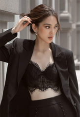 Tailored silk blazer with minimalist lapel and refined structure for elevated modern looks
