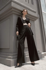 Tailored silk blazer with minimalist lapel and refined structure for elevated modern looks