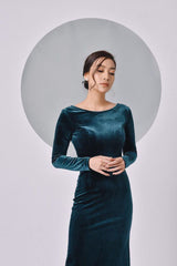 Elegant body-skimming velvet midi dress with long sleeves and deep scoop back detail