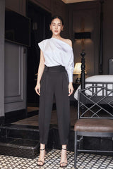 Silk high-waisted tapered pants with pleated front and tailored waistband for elegant structure