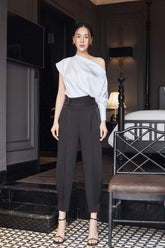 Silk high-waisted tapered pants with pleated front and tailored waistband for elegant structure