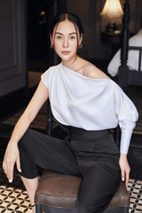 Silk high-waisted tapered pants with pleated front and tailored waistband for elegant structure