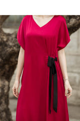V-neck silk midi dress with short sleeves and side tie detail for elegant everyday wear