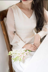 Elegant puff sleeve maxi dress crafted from sheer organza with tailored waistline