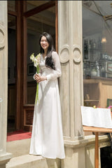 Elegant puff sleeve maxi dress crafted from sheer organza with tailored waistline