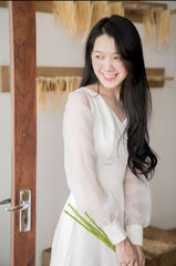 Elegant puff sleeve maxi dress crafted from sheer organza with tailored waistline