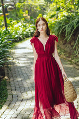Sleeveless pleated silk maxi dress with ruffle shoulder detail and deep V neckline