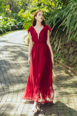 Sleeveless pleated silk maxi dress with ruffle shoulder detail and deep V neckline
