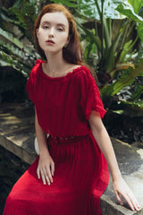 Pleated silk midi dress with soft sheer overlay and gathered waistline for elegant movement