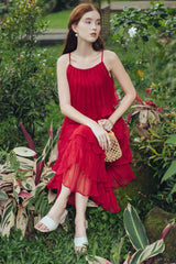 Tiered pleated organza midi dress with spaghetti straps and flared layered silhouette