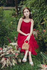 Tiered pleated organza midi dress with spaghetti straps and flared layered silhouette