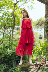 Tiered pleated organza midi dress with spaghetti straps and flared layered silhouette