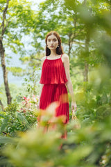 Tiered pleated organza midi dress with spaghetti straps and flared layered silhouette