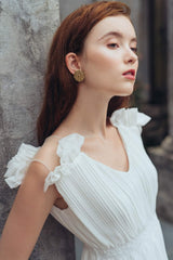 Pleated silk midi dress with ruffle hem and V-neckline for elegant formal occasions