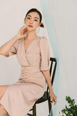 Silk midi wrap dress with V-neckline and ruched waist detail for a flattering silhouette