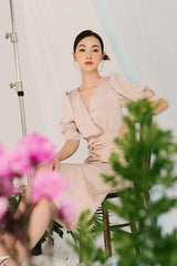 Silk midi wrap dress with V-neckline and ruched waist detail for a flattering silhouette