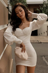 Silk bustier mini dress with long puff sleeves and tailored bodycon silhouette