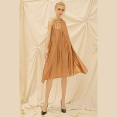 Sleeveless gathered organza dress with relaxed A-line silhouette and tie shoulder detailing