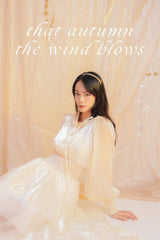 Flowy organza midi dress with puff sleeves and smocked waist for elegant movement