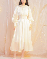 Flowy organza midi dress with puff sleeves and smocked waist for elegant movement