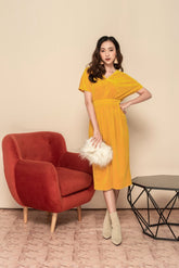 Soft velvet midi dress with V-neckline, short sleeves, and defined waistband for elegant shaping