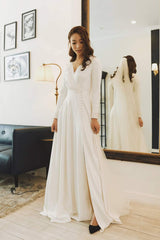 Elegant A-line silk dress with long sleeves and flowing full-length skirt for formal occasions