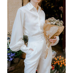 Silk button-down blouse with puff sleeves and wide cuffs for elegant everyday styling