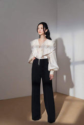 Silk blouse with layered ruffle collar, tie neckline and voluminous long sleeves