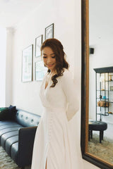 Elegant A-line silk dress with long sleeves and flowing full-length skirt for formal occasions