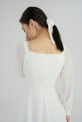 Elegant long-sleeve A-line maxi dress crafted from airy organza fabric