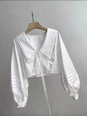 Silk blouse with oversized sailor collar and pleated lantern sleeves for feminine elegance