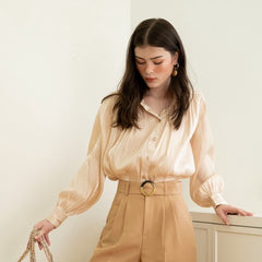 Textured silk blouse with pleated long sleeves and soft sheen finish for elegant styling