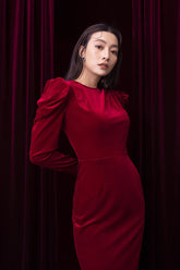Structured long-sleeve midi dress in soft velvet with statement shoulder detail