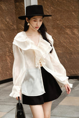 High-waisted silk skirt with pleated front and tailored silhouette for elegant styling