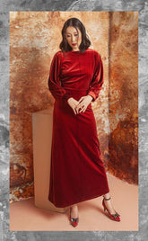 Velvet maxi dress with ruched sleeve detail and tailored silhouette for evening elegance