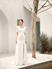 Silk dress with square neckline, puff sleeves, and front slit detail for modern elegance