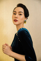 Elegant velvet midi dress with pearl-trimmed sleeves and boat neckline
