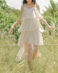 Layered organza dress with flowing tiers and delicate straps for ethereal summer elegance