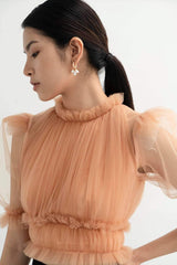 Ruffled organza blouse with pleated bodice, puff sleeves, and elastic waist detail