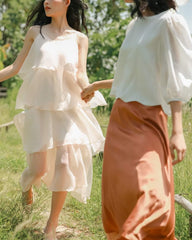 Layered organza dress with flowing tiers and delicate straps for ethereal summer elegance