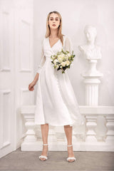 Silk organza midi dress with wrap bodice, sheer sleeves, and side button detail