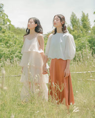 Layered organza dress with flowing tiers and delicate straps for ethereal summer elegance