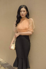 Silk flared midi skirt with front slit and pom-pom trim hem for elegant movement