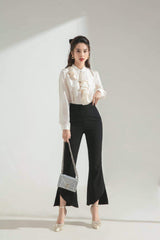 Silk blouse with cascading front ruffle and pearl collar button for timeless feminine elegance